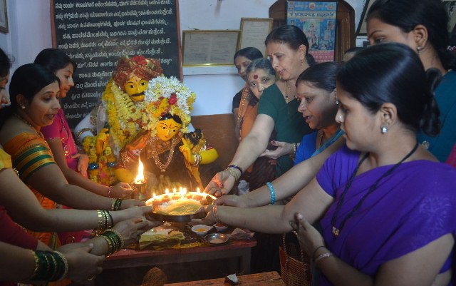 Tradional touch- Women offer poja to Rathi-Manmatha statues installed to celebrate holi