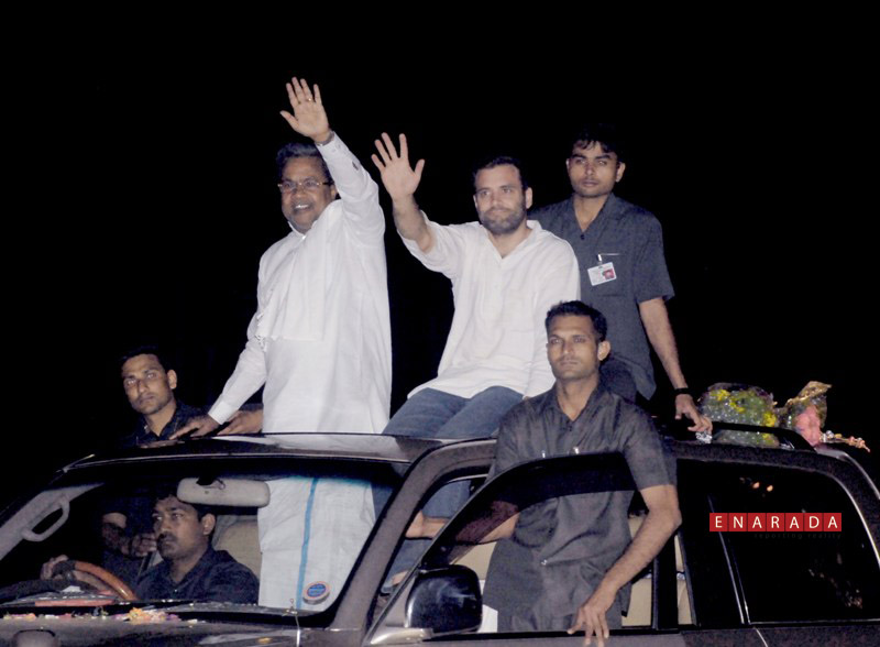 Rahul Gandhi and Karnataka Chief Minister Siddaramaiah waving to people gathered during  road show in Mysore tonight
