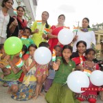 Art of Giving volunteers celebrating I-day with street kids. Pho