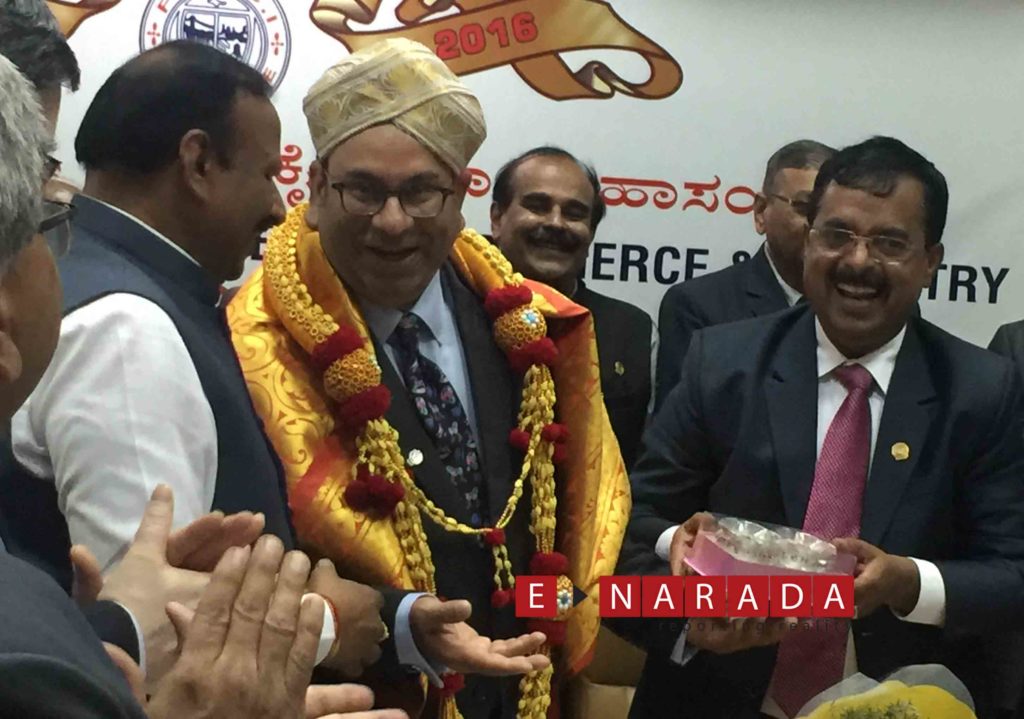 FKCCI President Sudhakar S Shetty  and other members honoured Sandip Somany with traditional Mysore turban and a shawl during an interactive session. Picture by e-Narada.com